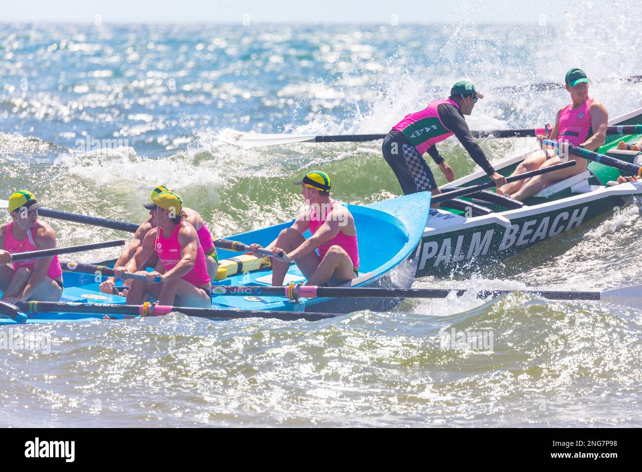 Sydney,Australia Surfboat racing carnival mens teams row and compete with another surfboat,NSW,Australia Stock Photo
