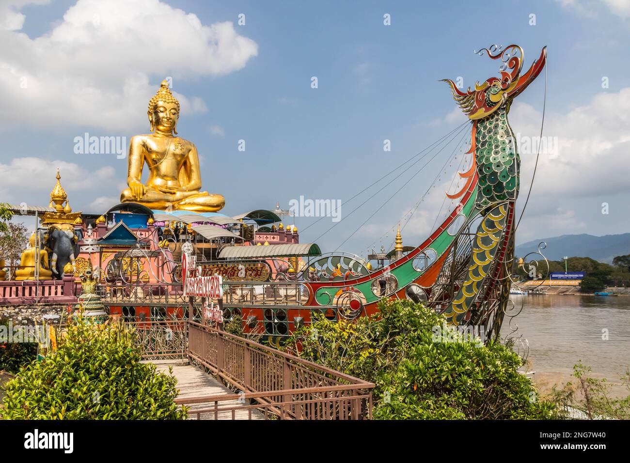 Buddah statue on boat on the Mekhong River at the Golden Triangle where from Thailand you can see Laos and Myanmar. Stock Photo