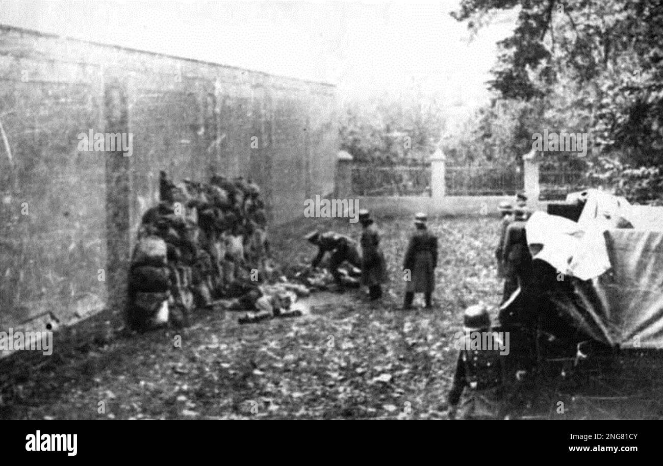 The early phase of the Holocaust was not with gas chambers but mobile execution squads known as Enisatzgruppen. Their task was to roam behind teh front lines shooting all the Jews they could. They killed an estimated  two million people. This photo shows Germans murdering Polish civilians in Leszno, Poland dated 21 October 1939. Stock Photo