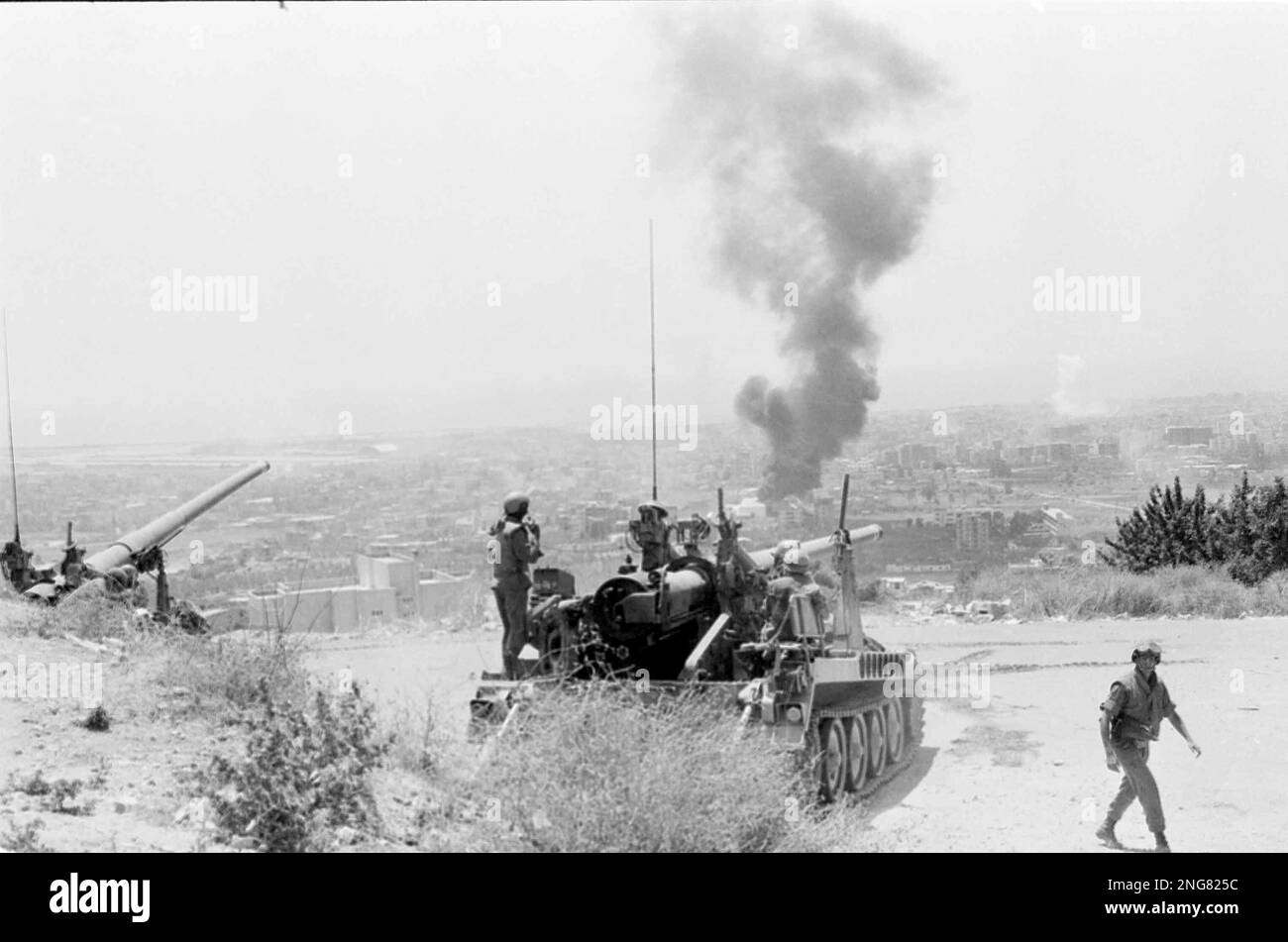 A white cloud rises in the distance over West Beirut after a 175 ...