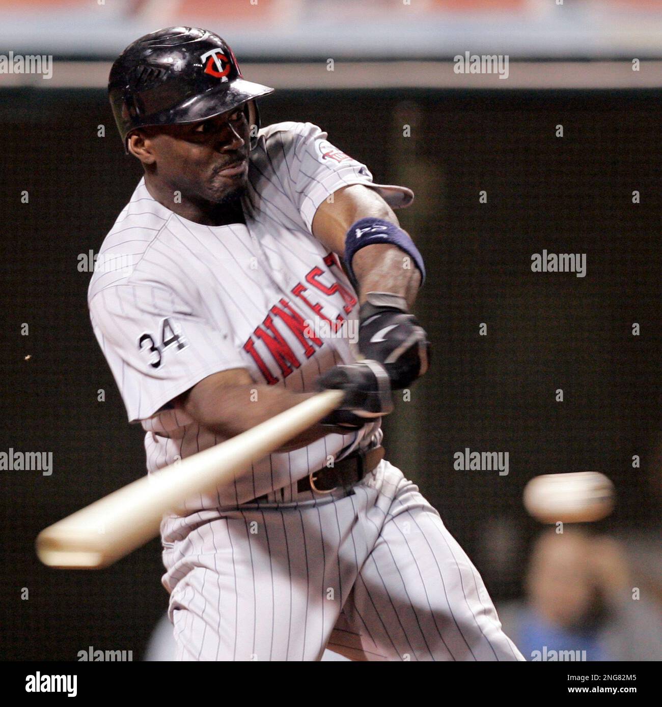 Minnesota Twins Rondell White hits into a double play against the ...