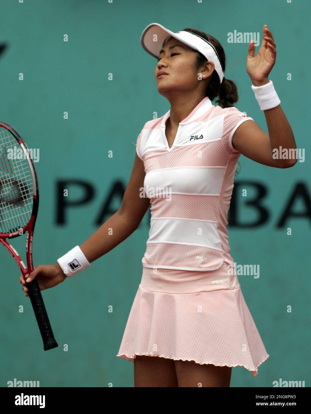 Japan's Akiko Morigami reacts after losing a second round match against U.S. player Shenay Perry during the French Open tennis tournament at the Roland Garros stadium in Paris, Thursday June 1, 2006. (AP Photo/Michel Euler) Stock Photo