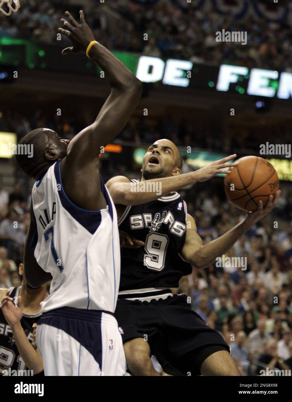 San Antonio Spurs Tony Parker (9) of France tries to shoot over Dallas Mavericks DeSagana Diop (7) in the first quarter in Game 6 of the NBA Western Conference semifinal basketball game