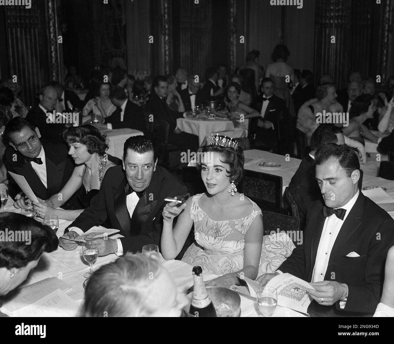 Actress Elizabeth Taylor, decked out in a glittering tiara and large