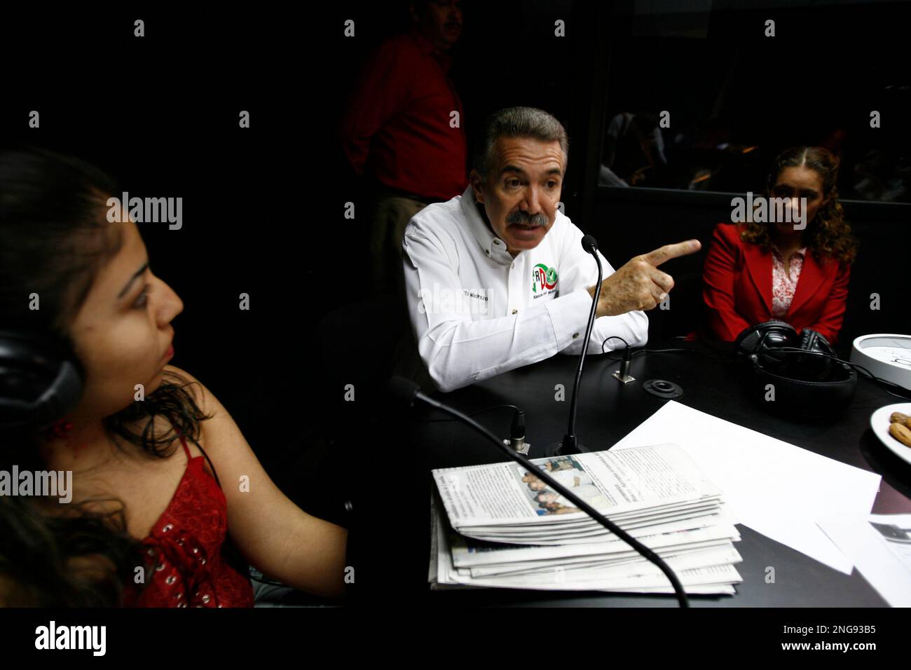 Mexican presidential candidate Roberto Madrazo, right, of the Institutional  Revolutionary Party, PRI, center, participates in a local morning radio  talk show in the city of Cuernavaca, Mexico on April 20, 2006. Madrazo,
