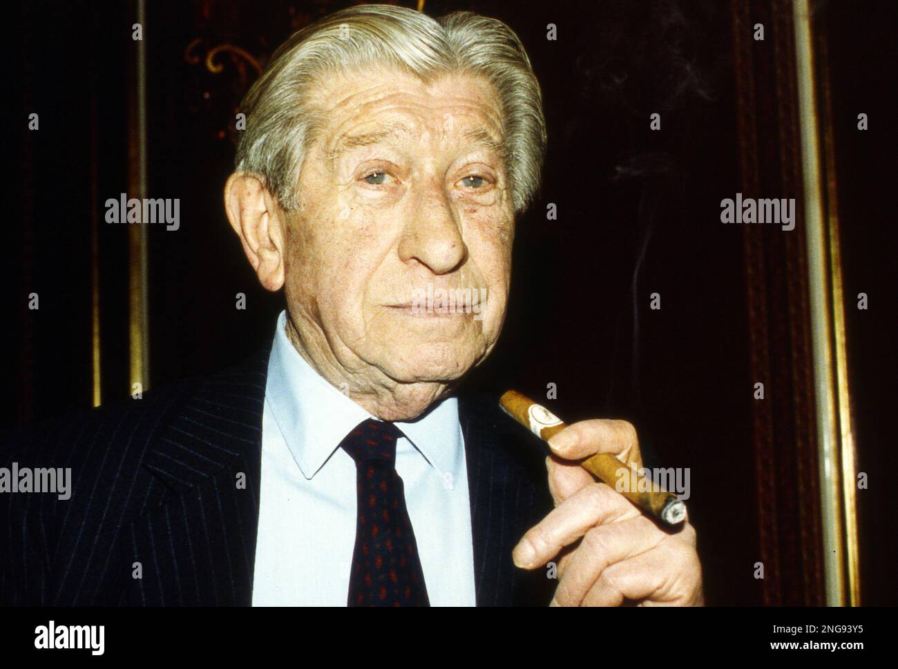 founder of cigarette Zino Davidoff, who turns 84, founder of the cigar manufactury, emjoys one  of his brandnew Santo Domingo cigars at a press conference in Geneva,  Switzerland, March 6, 1991. Davidoff who's Cuban Havana