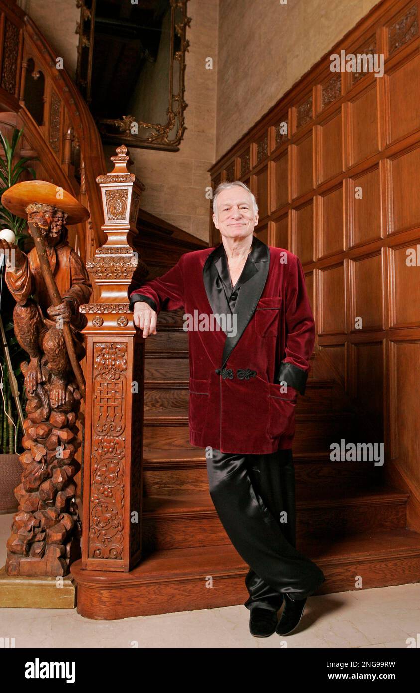 Playboy founder Hugh Hefner poses at the Playboy Mansion in the Holmby ...