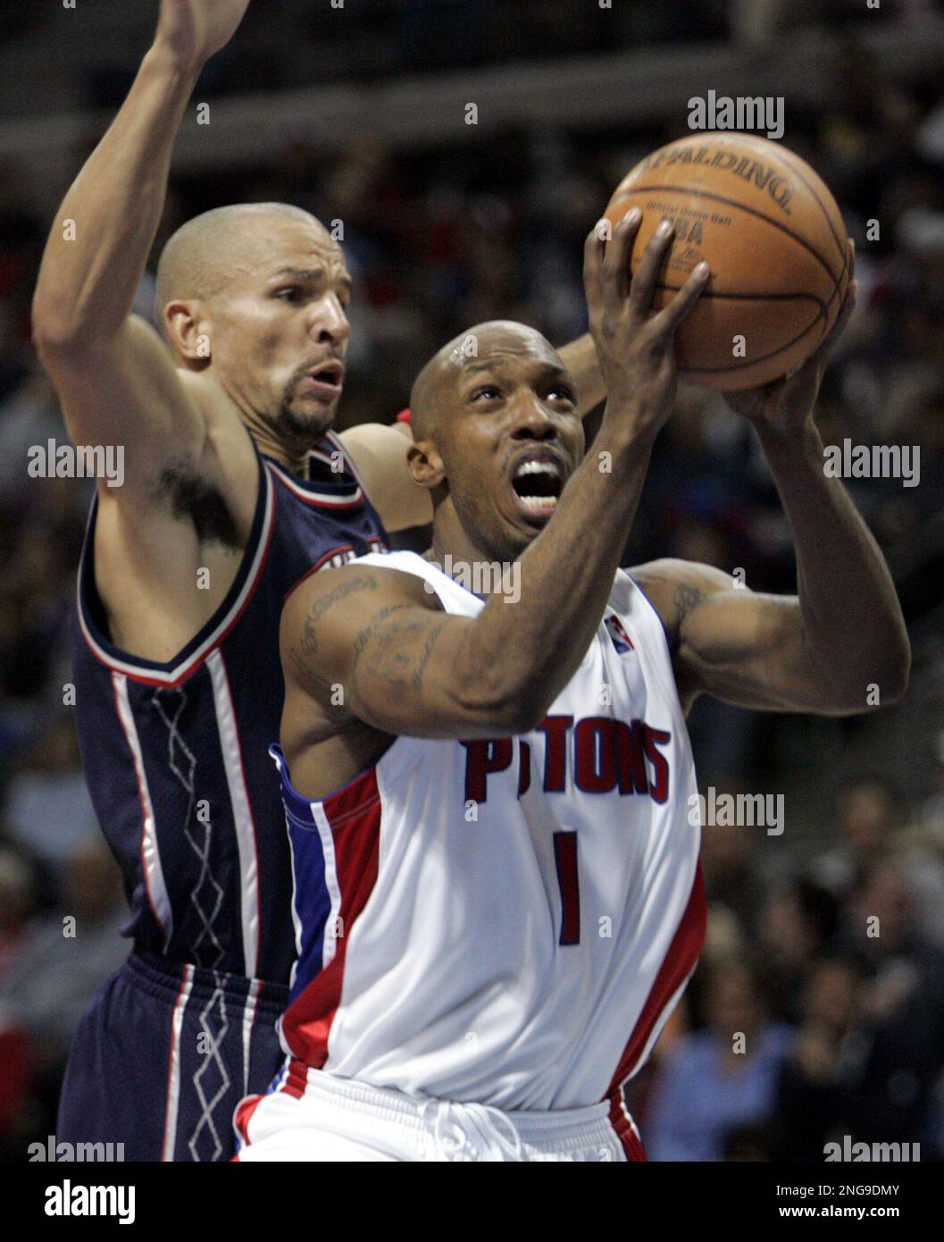 Detroit Pistons guard Chauncey Billups is defended by New Jersey Nets