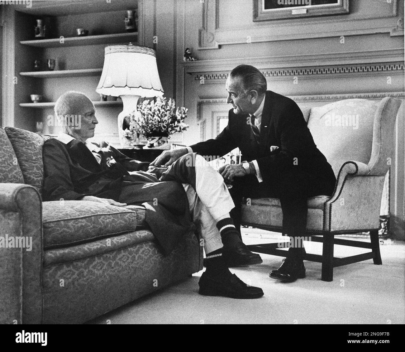 President Lyndon Johnson chats with former President Dwight D