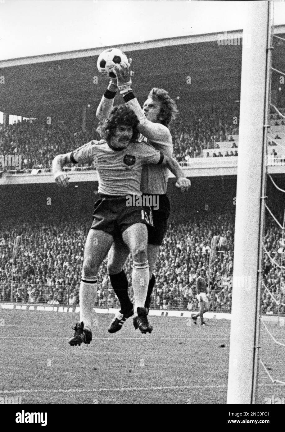 Germany's goalkeeper Sepp Maier saves the ball in front of Australian