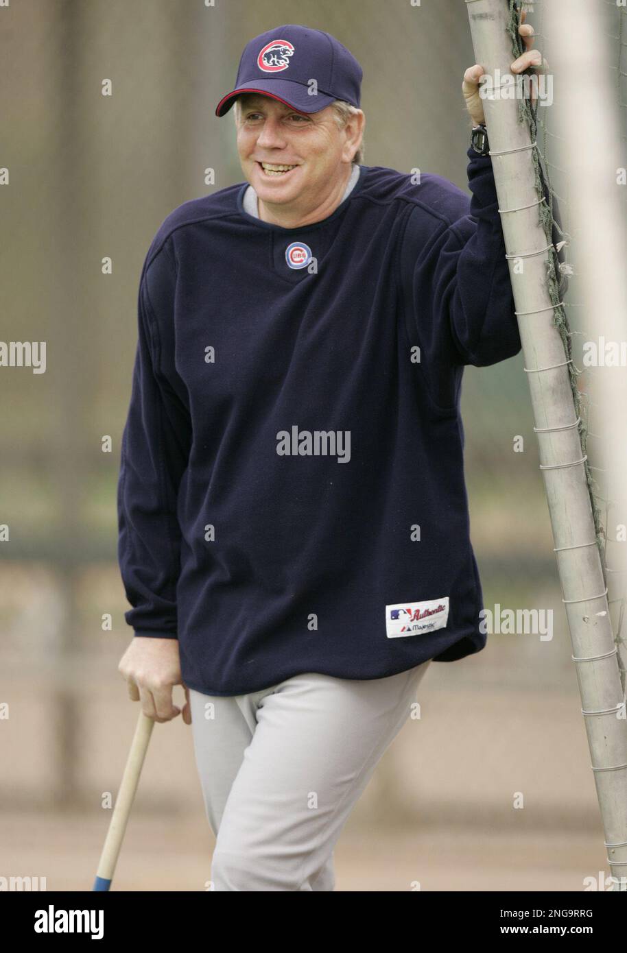 Chicago Cubs pitching coach Larry Rothschild smiles as he watches