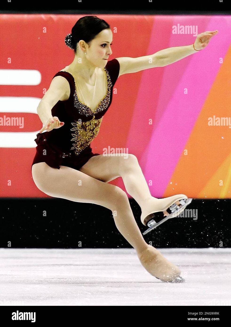 Sasha Cohen of the United States falls during the first jump of her