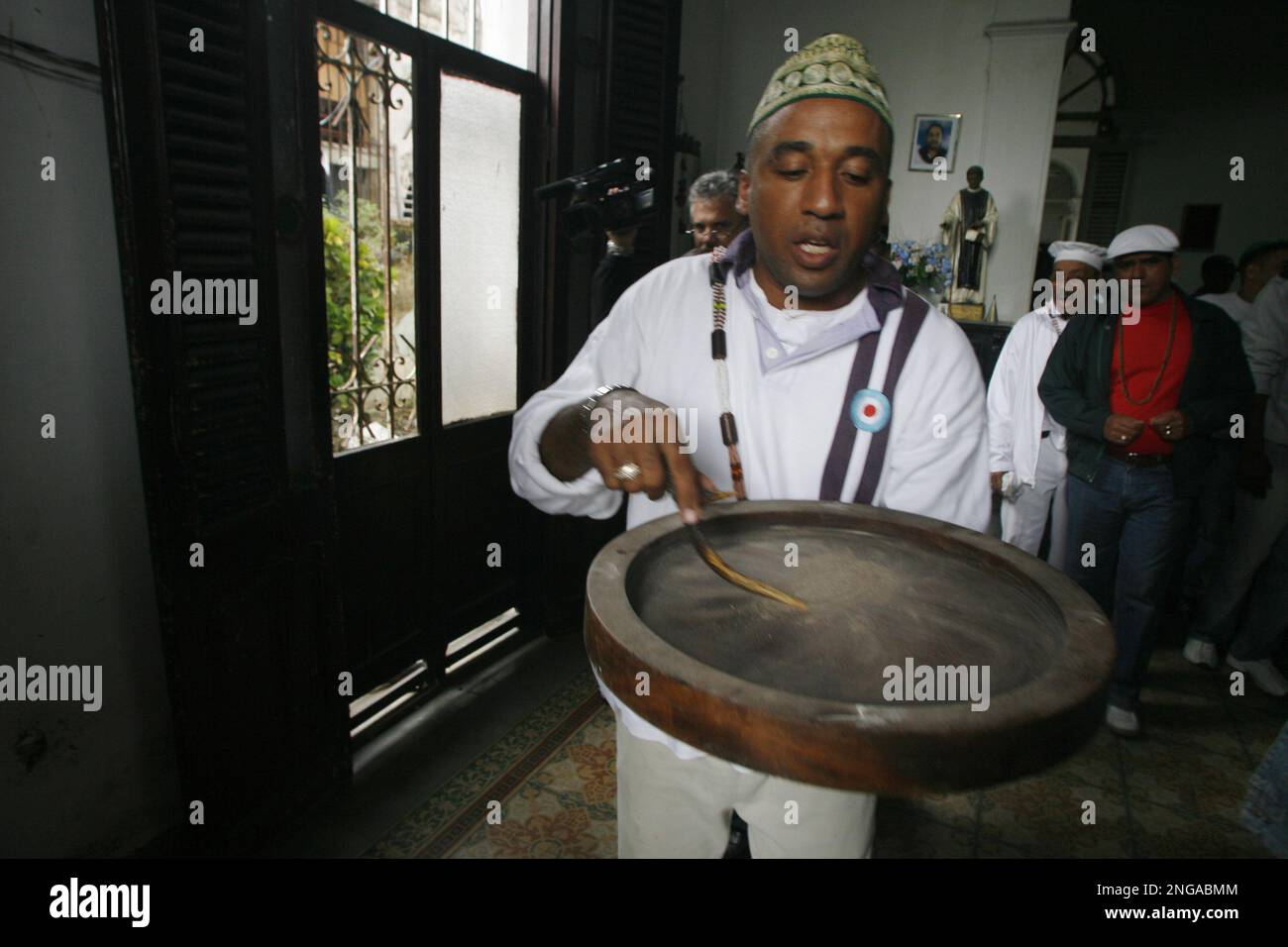 Cuban Santeria priests, or babalaos, are seen praying during a Santeria ...