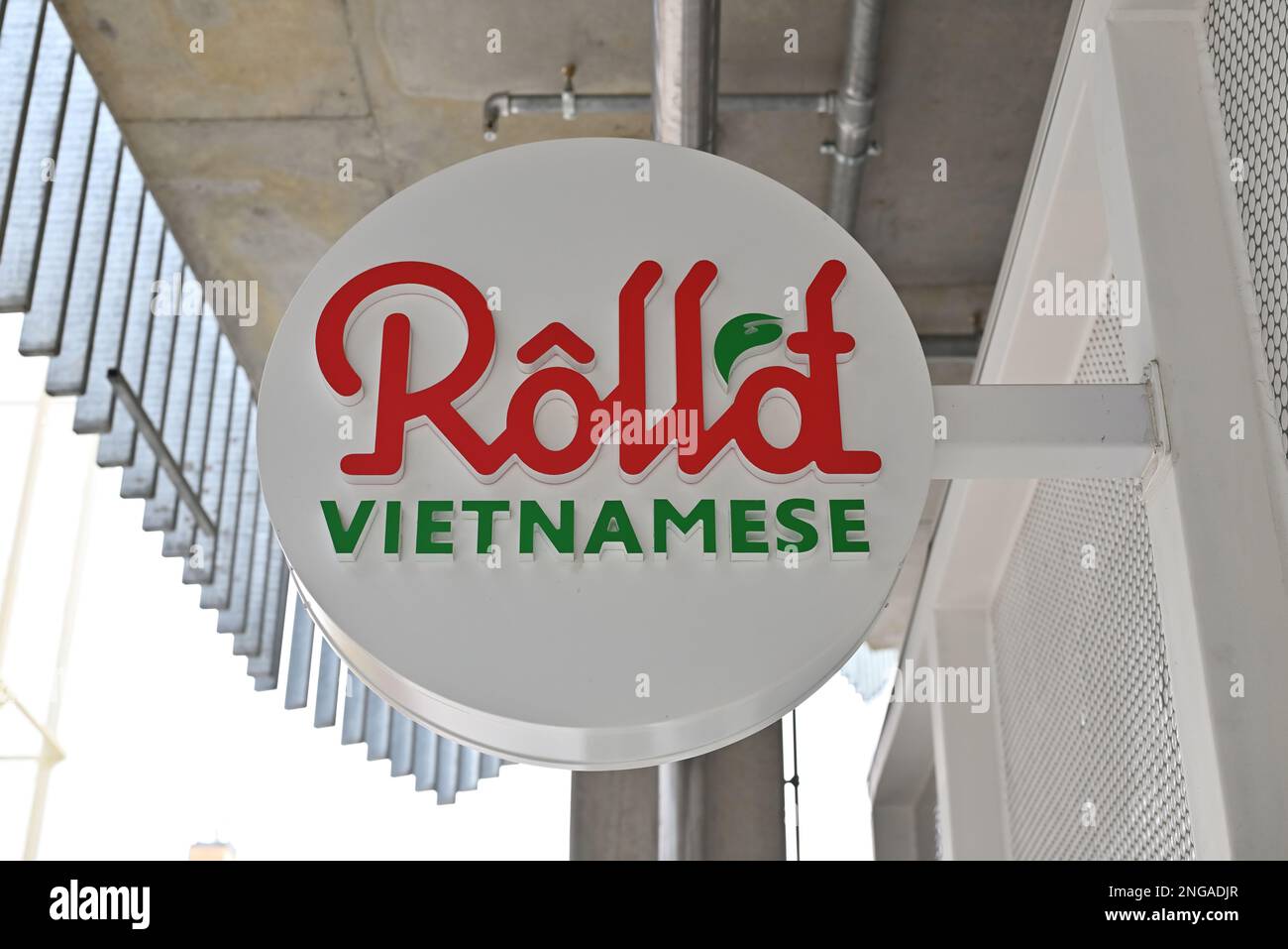 White, red, and green sign outside a Roll'd Vietnamese restaurant in Melbourne Stock Photo