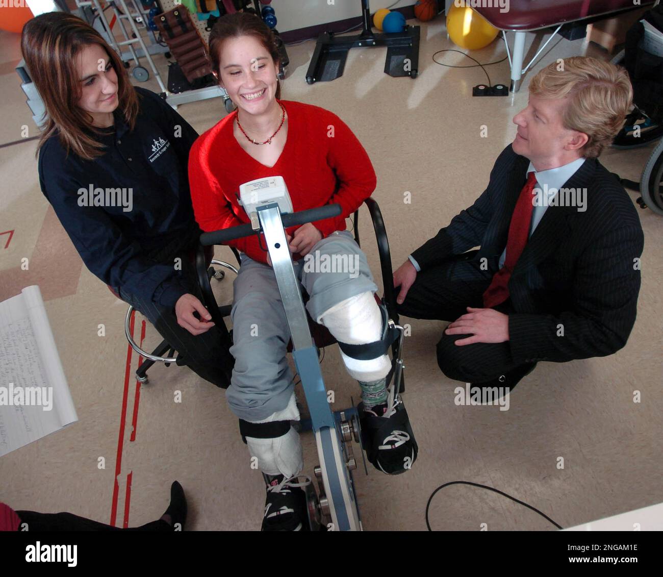 Spinal cord injury patient Loretta McRae rides a functional electrical