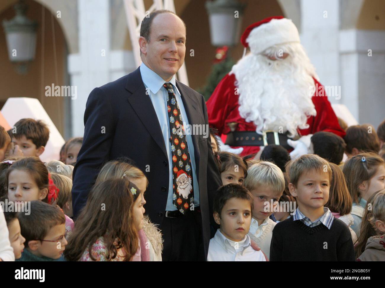 Prince Albert II of Monaco poses with Monaco's children and santa Claus