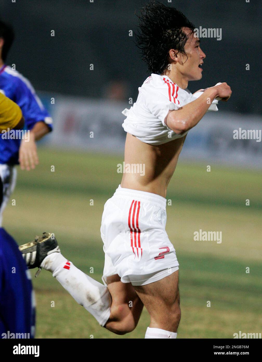 China's Du Wei celebrates after scoring a goal against Japan during the ...