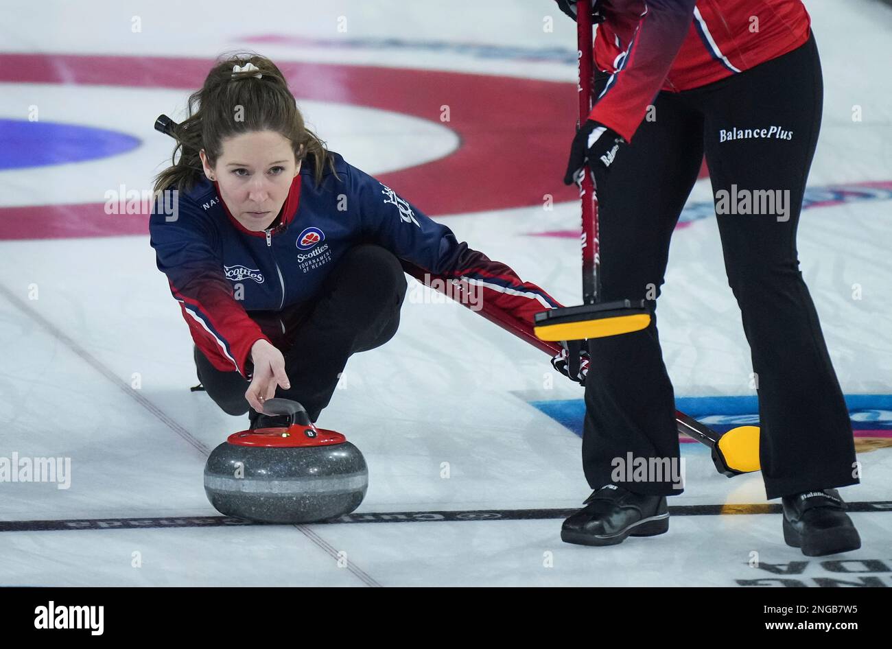 Wild Card 1 skip Kaitlyn Lawes delivers a rock while playing against