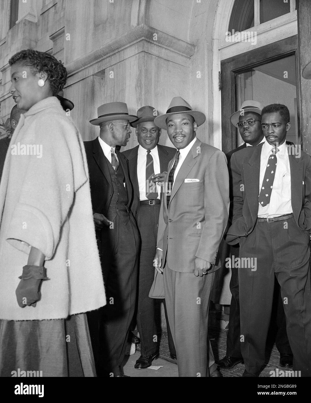 The Rev. Dr. Martin Luther King, Jr., center, appears at noon recess on ...