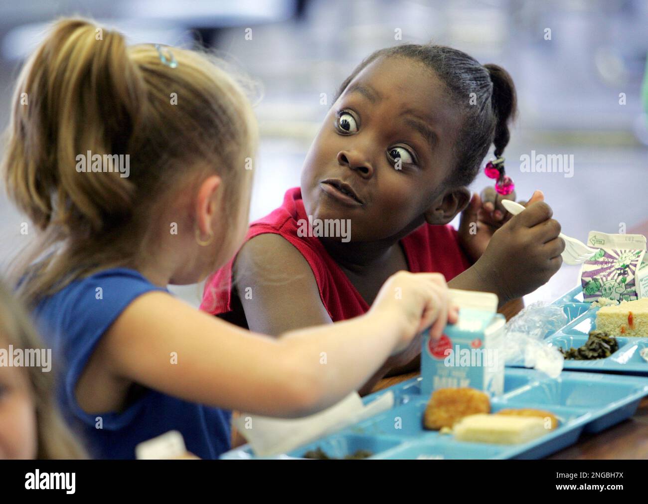 ADVANCE FOR MONDAY AUG. 29 ** Southview Primary School first graders Lei,  right, talks with classmate Karsen over lunch at the school Wednesday, Aug.  17, 2005, in Opelika, Ala. For more, image size:1300x1011