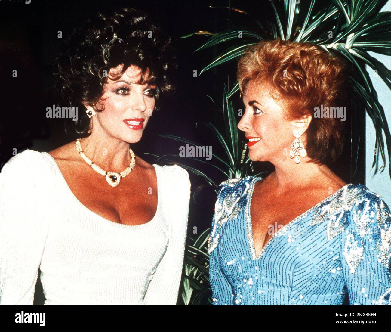 British actresses Joan Collins, left, and Elizabeth Taylor attend a