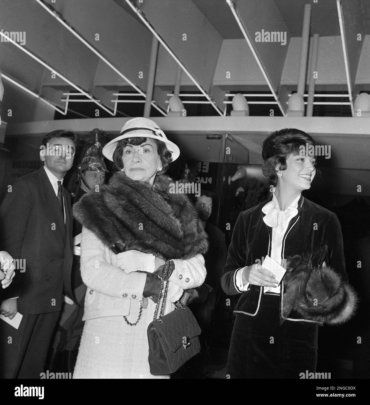 Fashion designer Gabrielle "Coco" Chanel, left, and Marie Helene Arnaud  attend the gala performance of "A Frenchman in Moscow" at the Kinopanorama  hall at La Motte Piquet in Paris, France, Oct. 13,