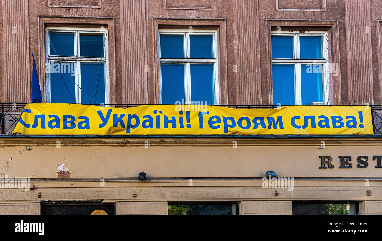 War in Ukraine. One of the many flags 'Slava Ukraine, Heroes of Glory' - hung on many buildings in Warsaw. Help Ukraine. Stock Photo