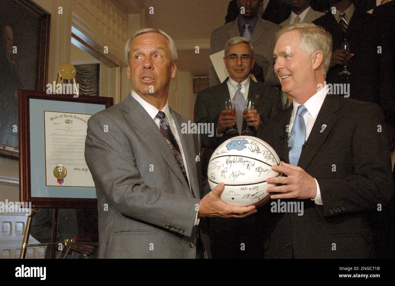 Mike Rasley North Carolina men's basketball coach Roy Williams, left, gives North ...