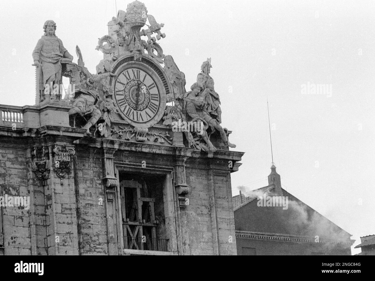White smoke billows around the chimney atop the Sistine Chapel on Aug