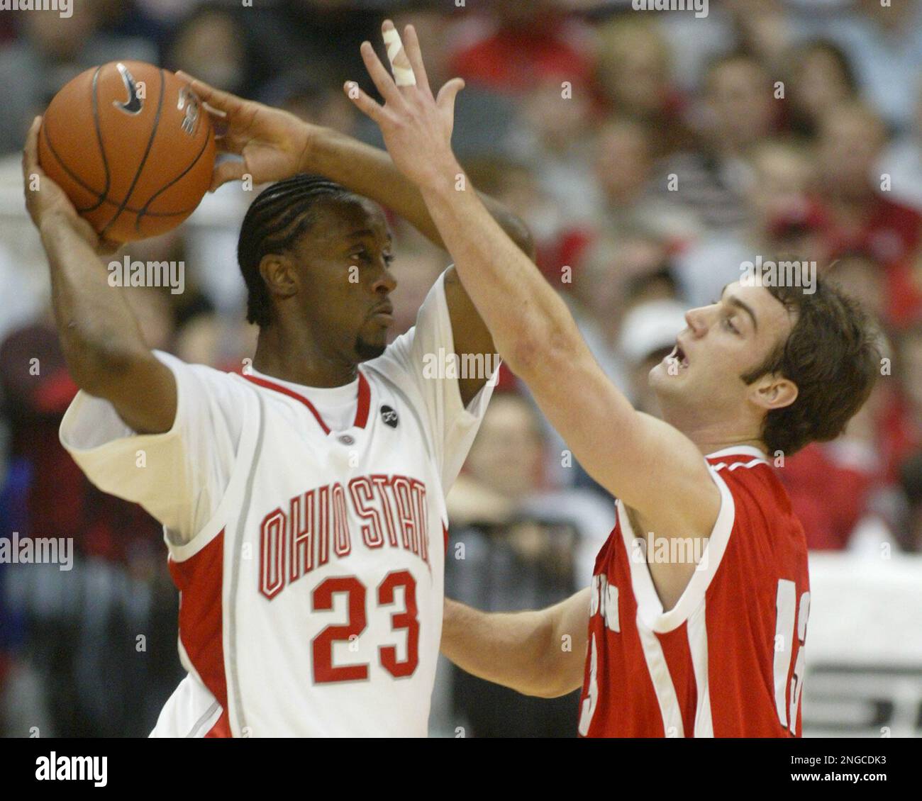 Wisconsin's Clayton Hanson (13) guards Ohio State's Je'Kel Foster (23