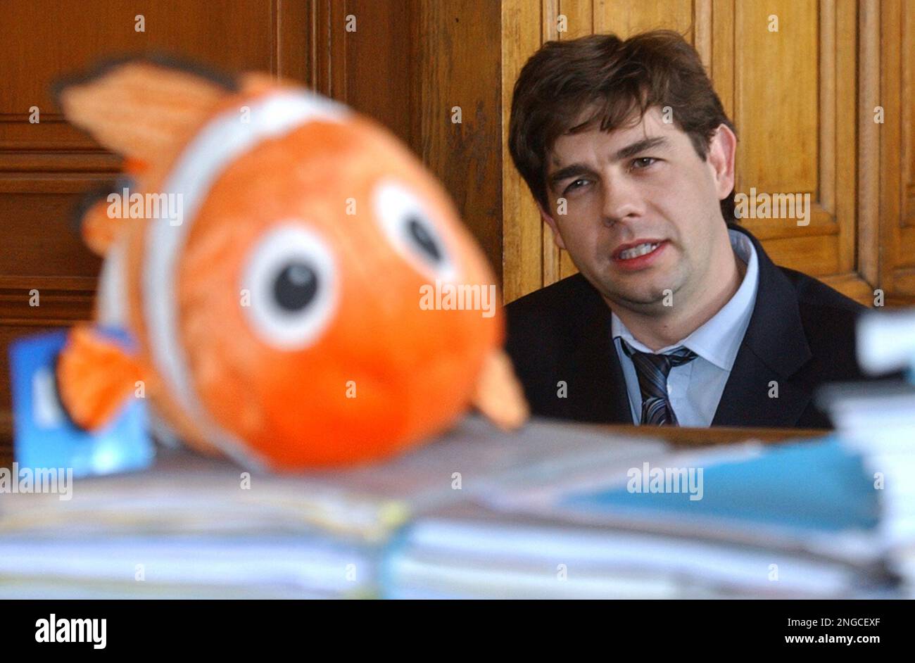 French childrens book author Franck Le Calvez looks at a soft toy of the  fish Nemo the main character in Disneys film Finding Nemo Wednesday,  Feb. 23, 2005 at the Paris courthouse.