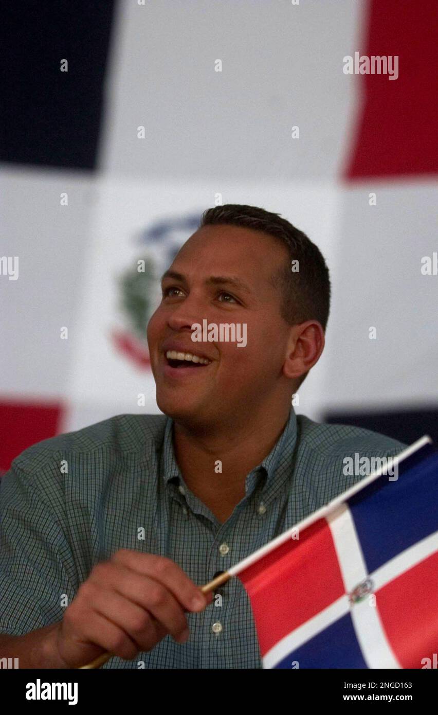 New York Yankees baseball player Alex Rodriguez, waves a Dominican flag