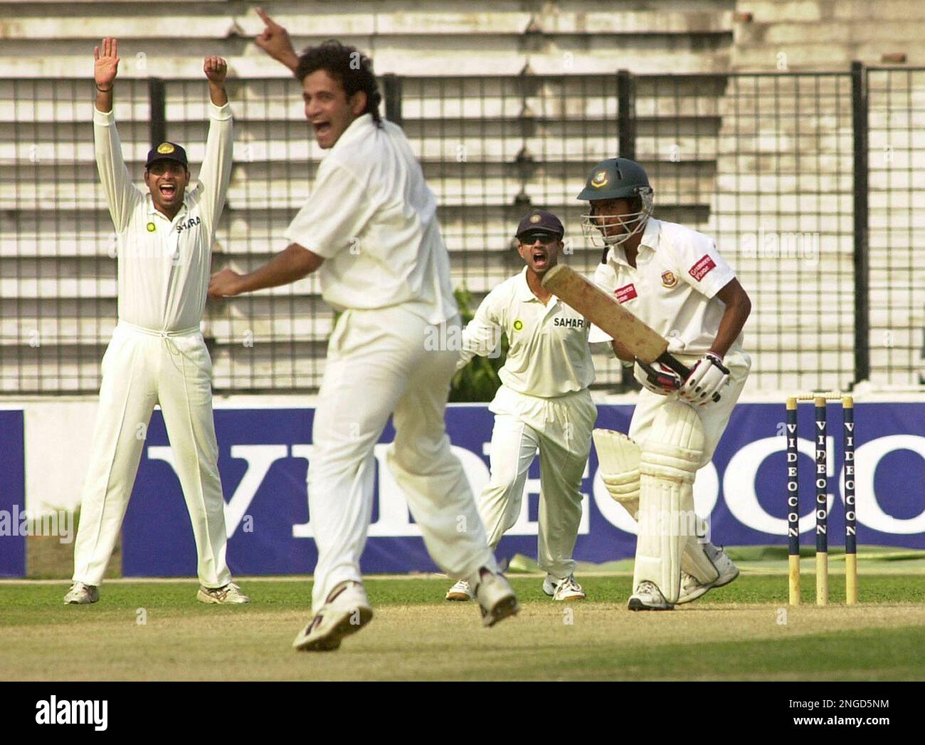 Indian cricketers celebrate the dismissal of Bangladesh batsman