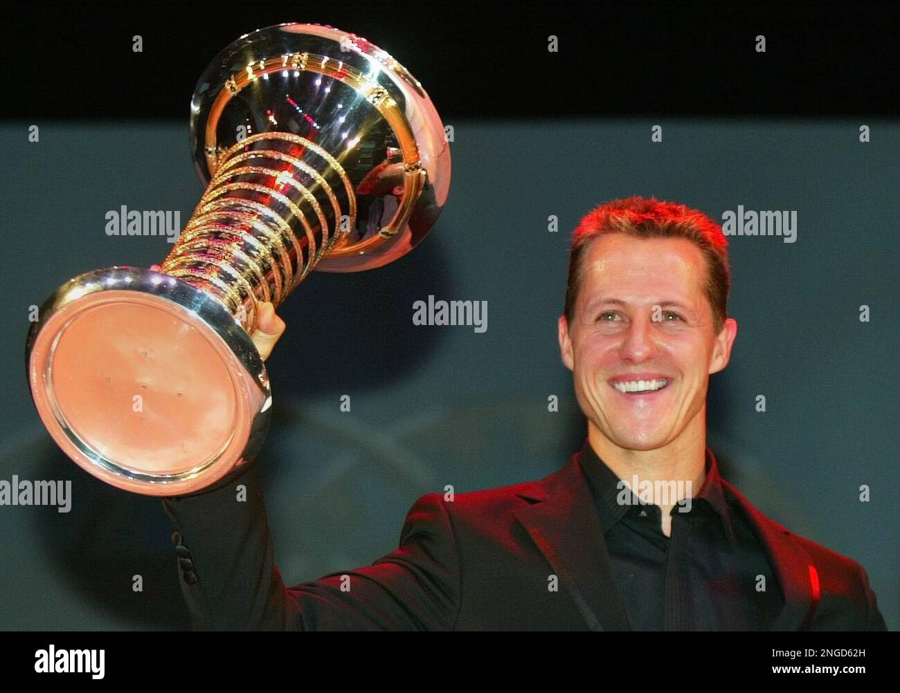 German Formula One driver Michael Schumacher holds his FIA Formula On…