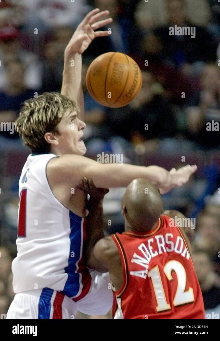Detroit Pistons' Darko Milicic, of Serbia & Montenegro, left, is fouled