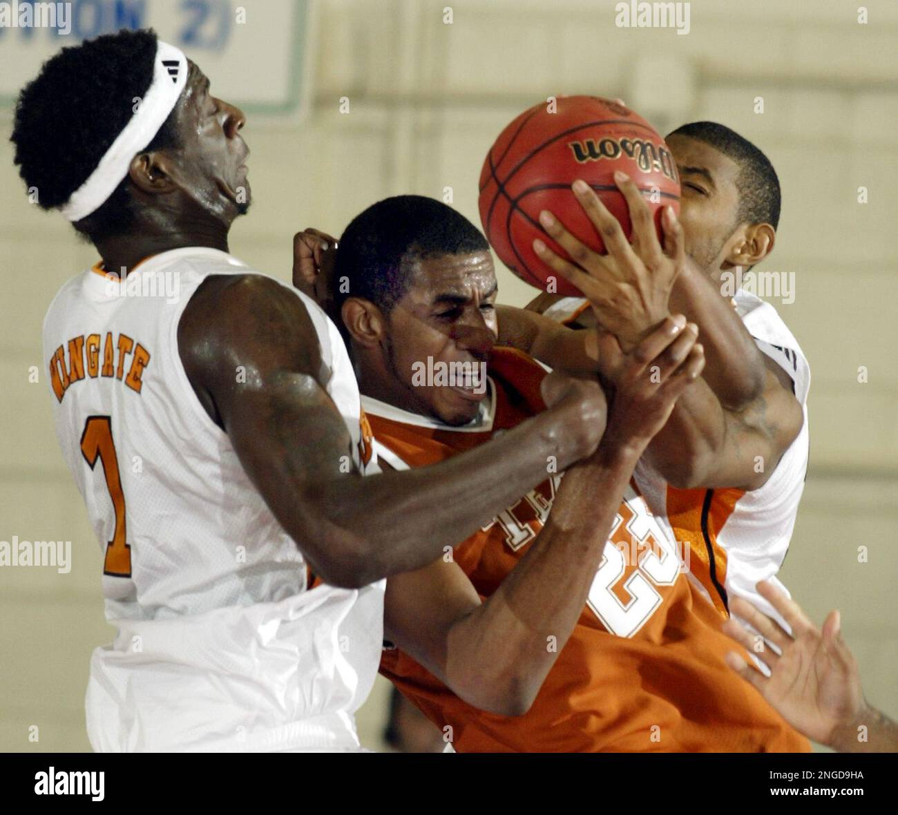 Texas LaMarcus Aldridge center is tied up by Tennessee s Major Wingate left and Andre Patterson in the second half in a game for third place in the Maui Invitational in Lahaina Hawaii