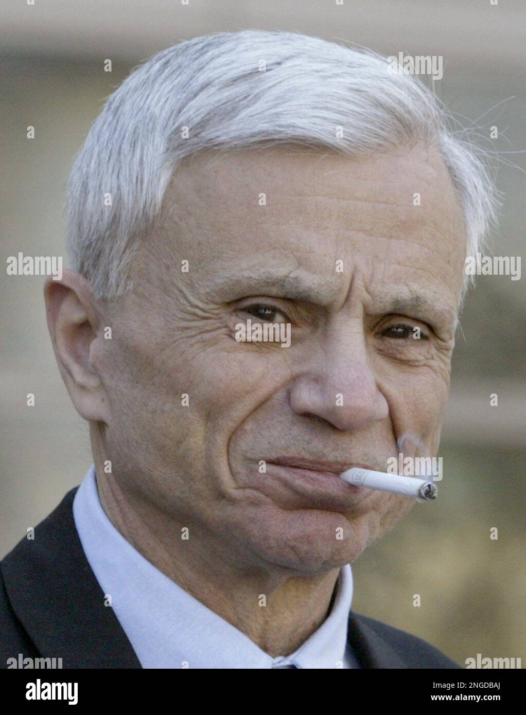 Actor Robert Blake smokes a cigarette as he leaves Los Angeles Superior Court Wednesday, Nov. 17 , 2004, during jury selection in his murder trial. Blake is charged with murdering his wife, Bonny Lee Bakley, who was shot to death outside a San Fernando Valley restaurant more than three years ago. (AP Photo/Nick Ut) Stock Photo
