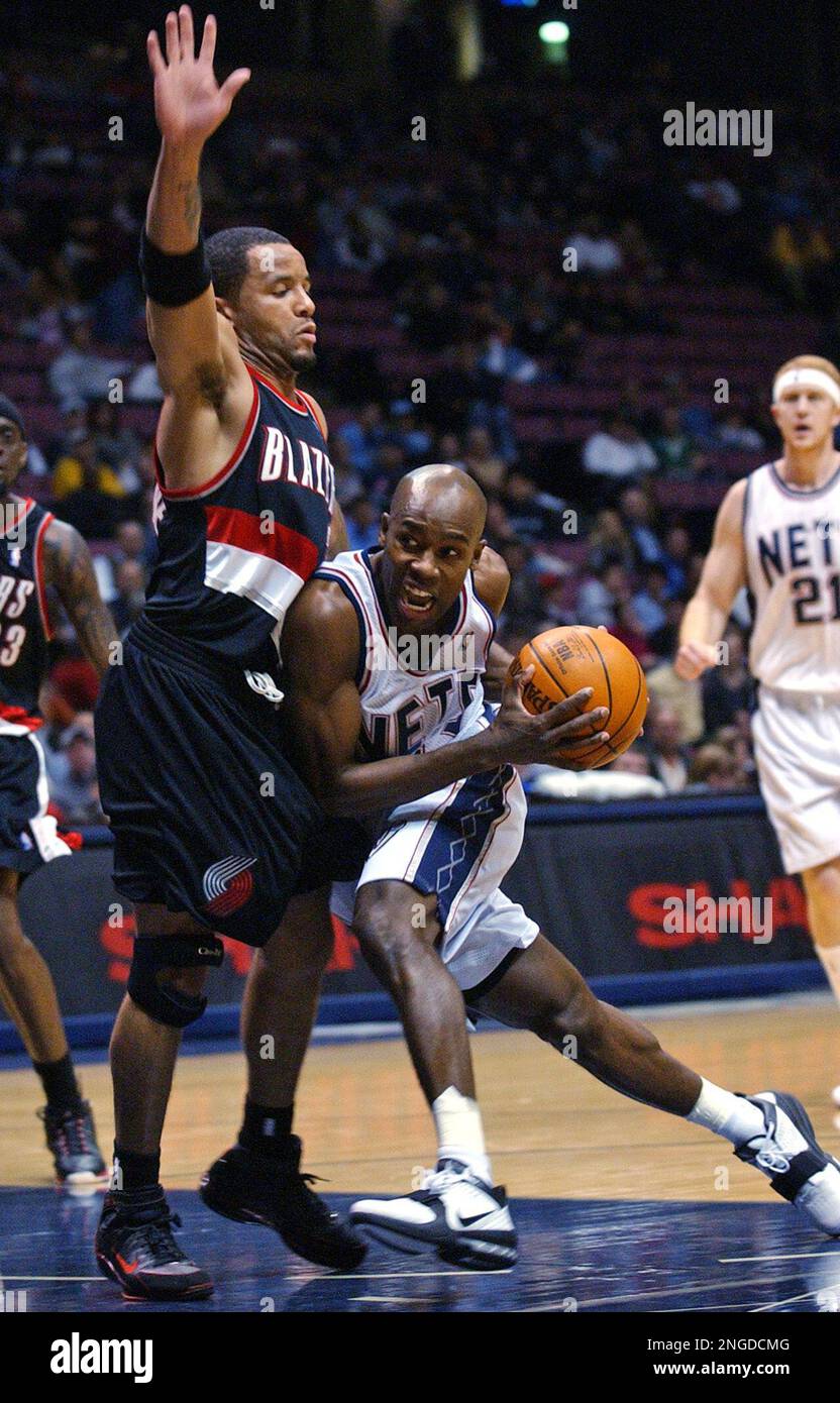 New Jersey Nets' Jacque Vaughn (11) loses control of the ball to the Memphis  Grizzlies' Lorenzen Wright (42) in the second half of the Grizzlies' game  against the Nets, Friday, Dec. 17