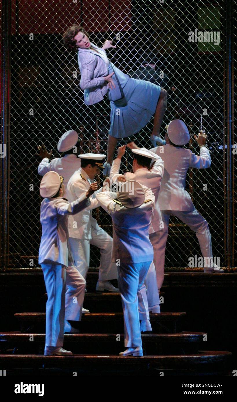 Brooke Shields, center on fence, performs the musical number "Conga