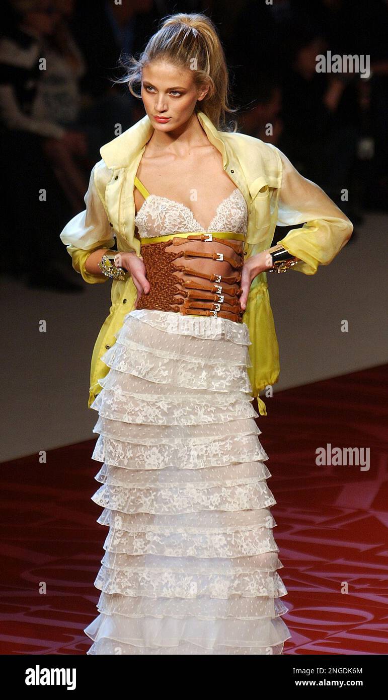 A model presents a lond evening dress designed by Italian fashion designer  Valentino for his spring-summer 2005 ready-to-wear fashion collection  presented Sunday, Oct. 10, 2004 in Paris. (AP Photo/Remy de la Mauviniere