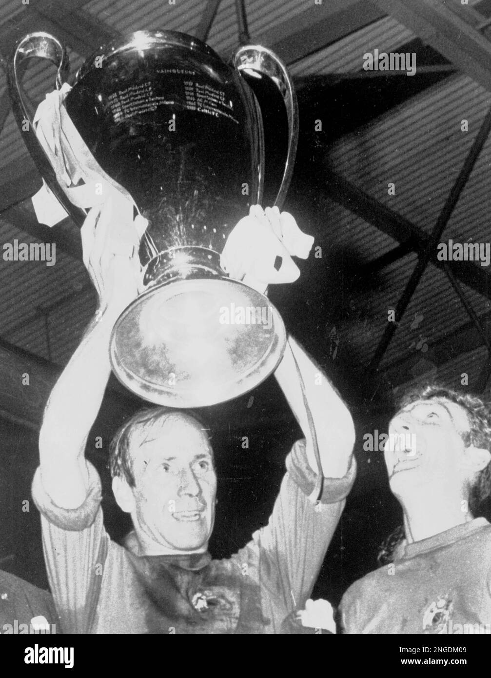 Manchester United captain Bobby Charlton holds aloft the European Cup ...