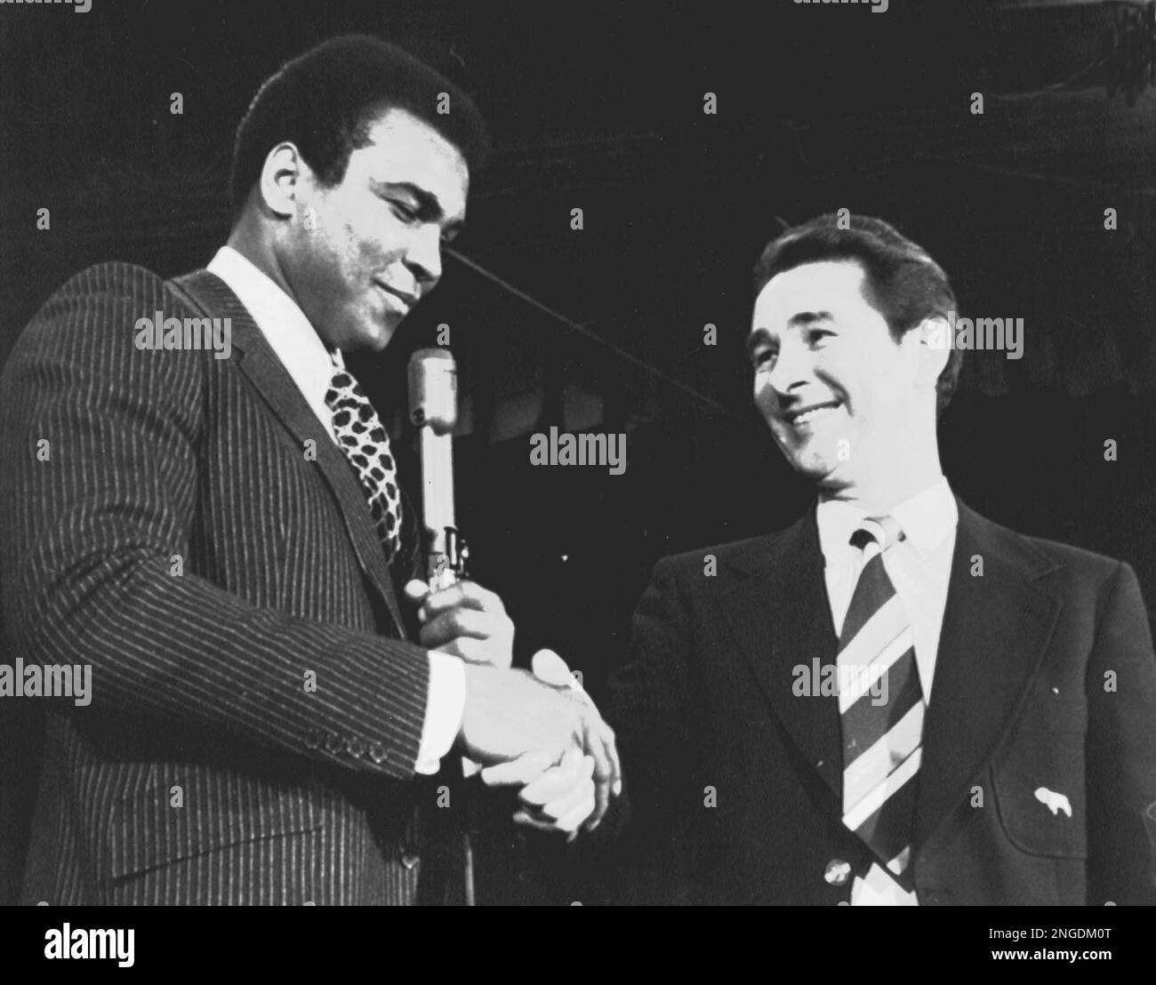 U.S. boxer Muhammad Ali shakes hands with British football manager