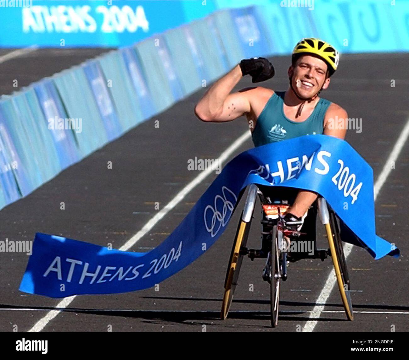 Australia's Kurt Fearnley crosses the finish line as he wins the gold 