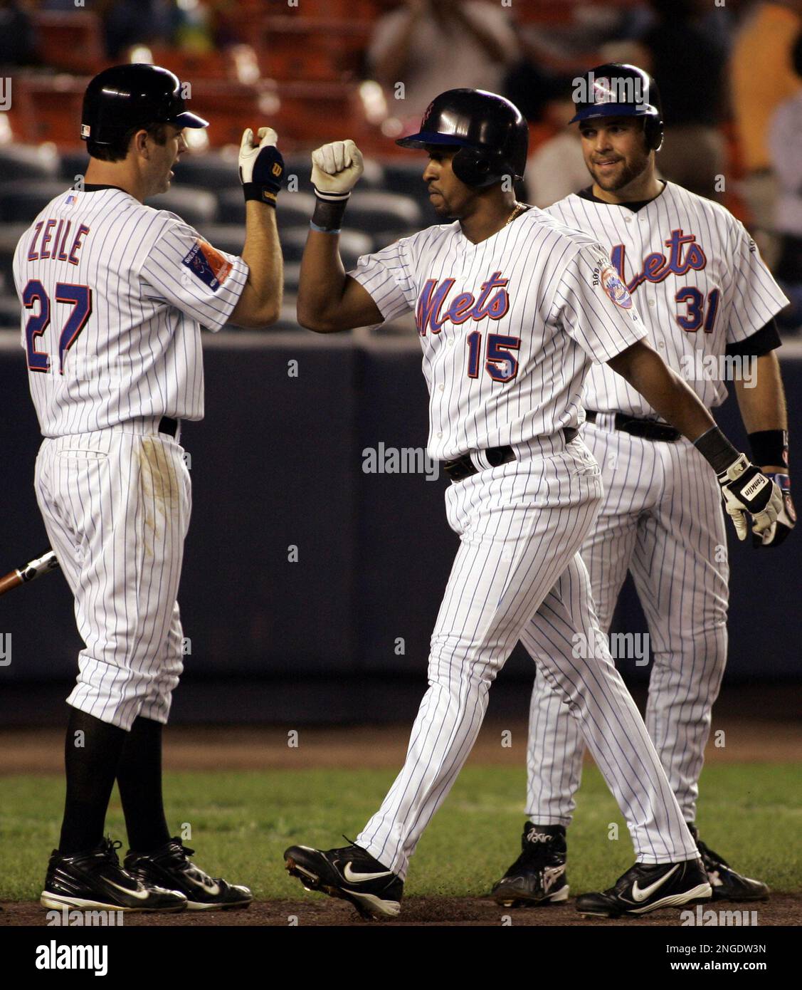 New York Mets' Mike Piazza is congratulated by Richard Hidalgo after  hitting a solo home run against the Florida Marlins during the third  inning, Monday, Aug. 30, 2004 at Shea Stadium in