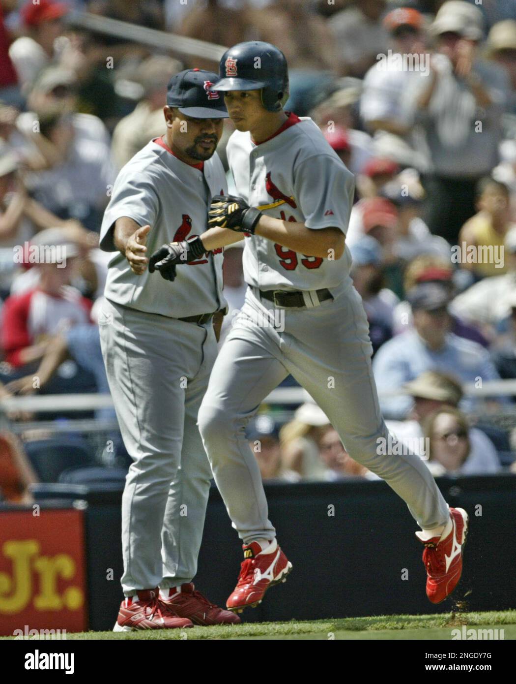 St. Louis Cardinals' So Taguchi is congratulated by third base
