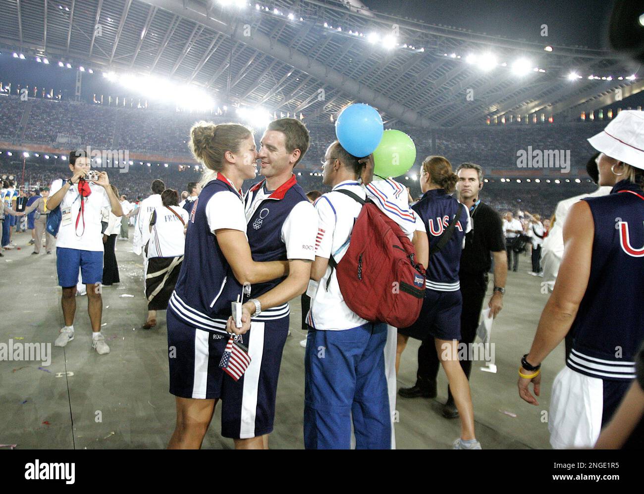 U.S. athletes Sarah Jones and Jeff Donaldson embrace during the closing