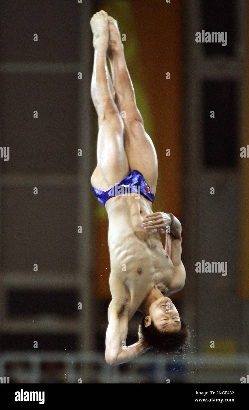 China's Tian Liang competes in the preliminaries of the Men's 10 meter ...