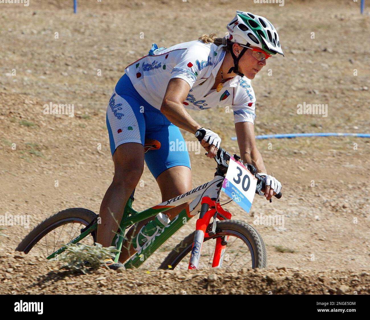 Defending olympic champion Paola Pezzo, of Italy, trains on the course  where the mountain bike race of the Olympic Games 2004 will be run, in the  outskirts of Athens, Wednesday, Aug. 25,