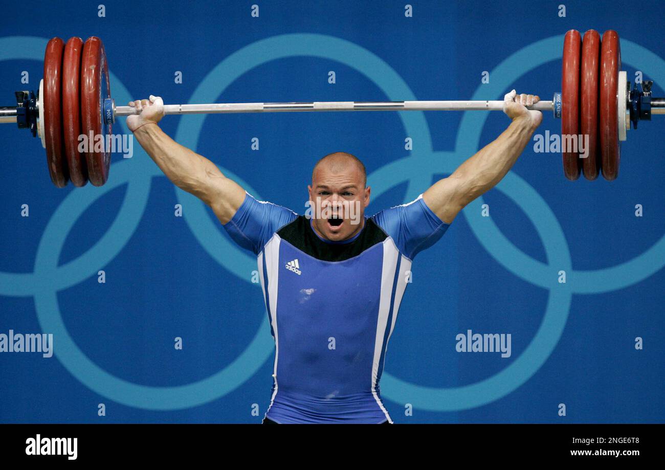 Milen Dobrev of Bulgaria cleanly lifts 413 lbs 187.5 kg in the snatch during the men s 207 lb 94 kg event at the Nikaia Olympic Weightlifting Hall during the Summer Olympics in