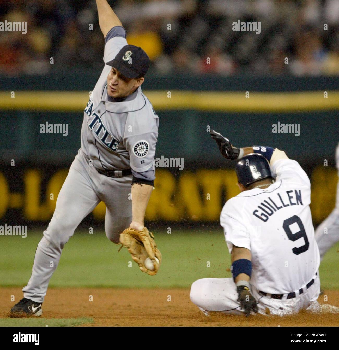 Seattle Mariners second baseman Bret Boone, right, walks in the dugout in  the seventh inning against the New York Yankees Friday, Aug. 13, 2004, at  Safeco Field in Seattle. (AP Photo/Ted S.